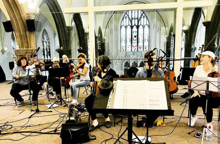 A live orchestra in a modern church