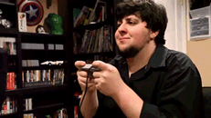 Gif of boy holding controller and screaming internally