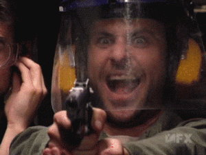 Charlie Kelly from IASIP firing a gun and laughing