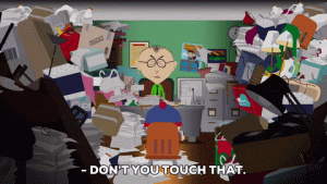 Mad Stan from South Park in a room full of junk