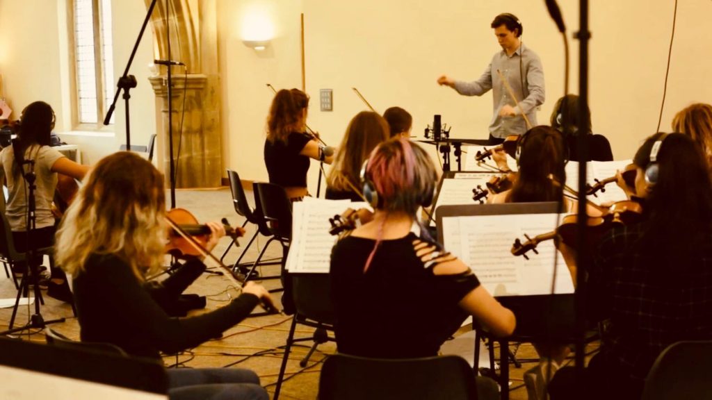 Live orchestra playing in a modern church