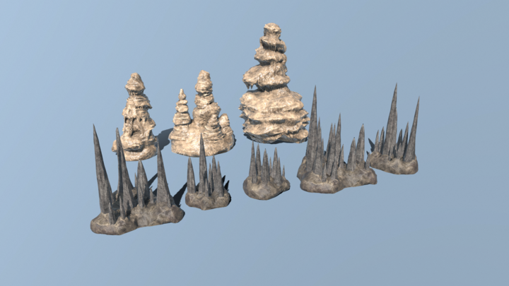 2 rows of flowstone and stalagmite set pieces lined up